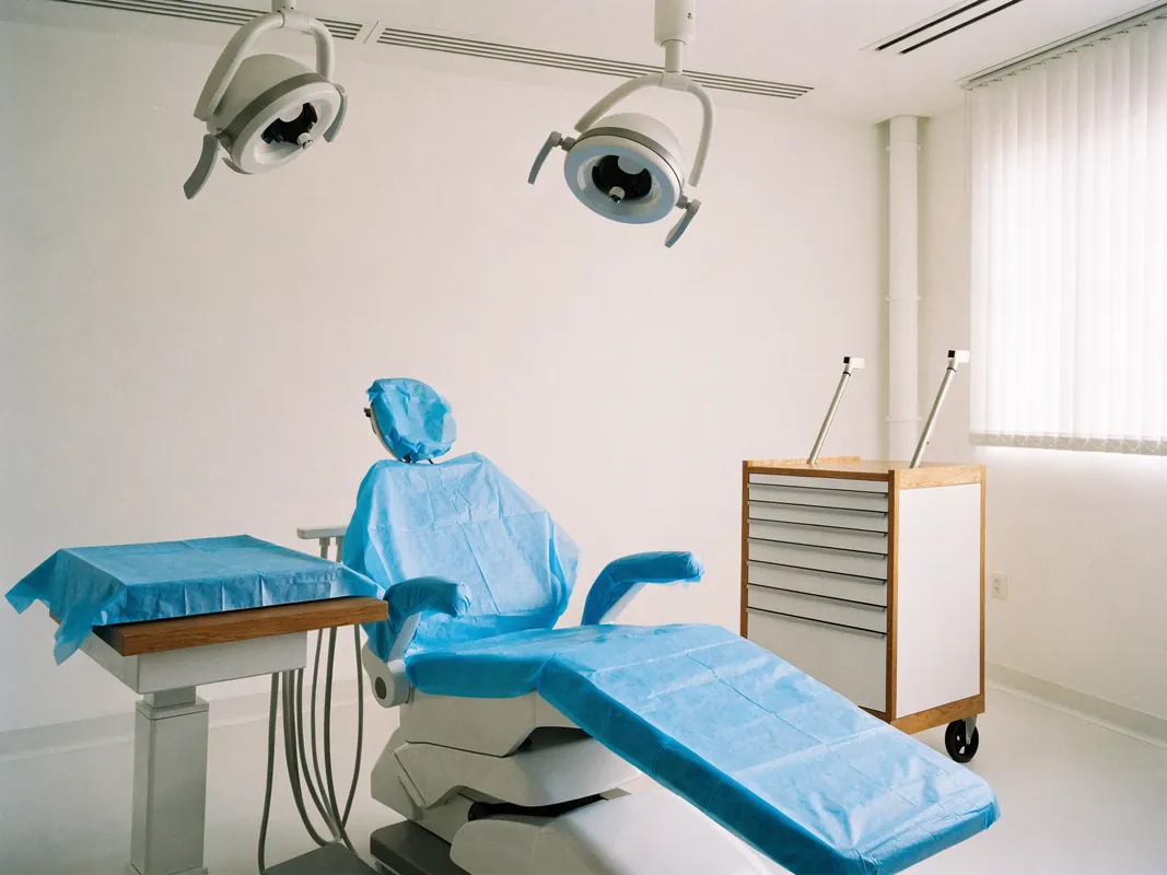 Dental treatment room prepared and draped, ready for the next procedure