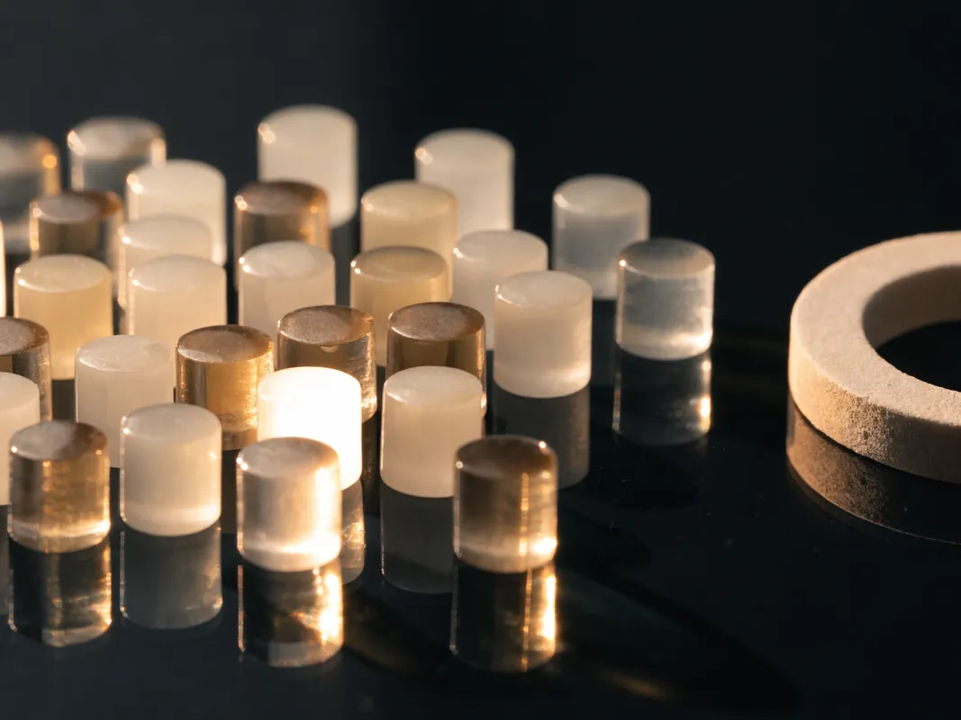 Lithium disilicate press ingots in different translucencies on a laboratory surface