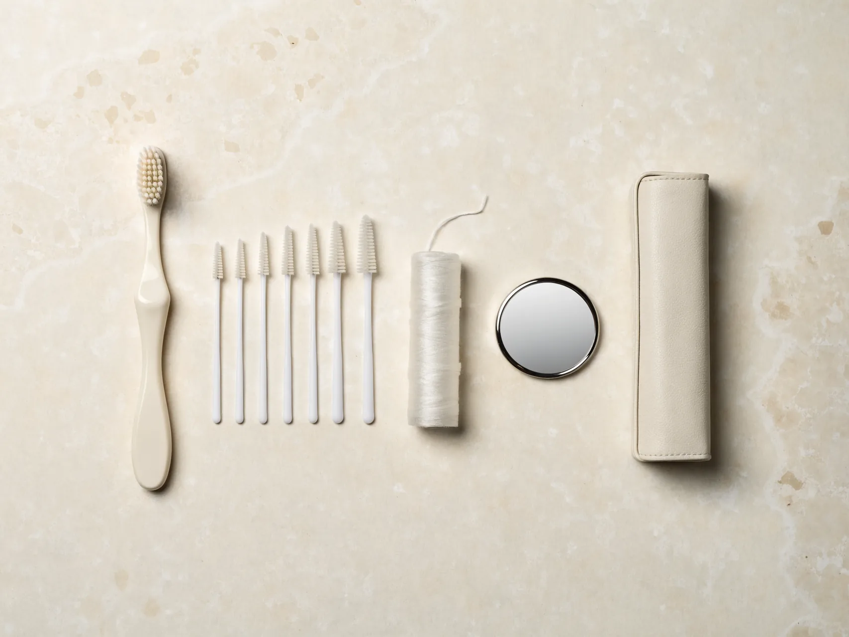 Oral care kit with a soft toothbrush, graded interdental brushes, floss and a travel case